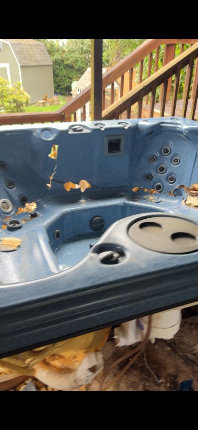 Dismantled hot tub shell cleared during removal in Bellevue