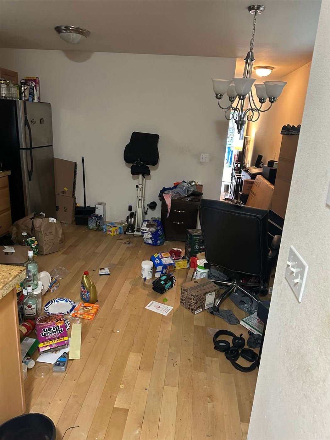 Cluttered kitchen floor before junk removal in Renton
