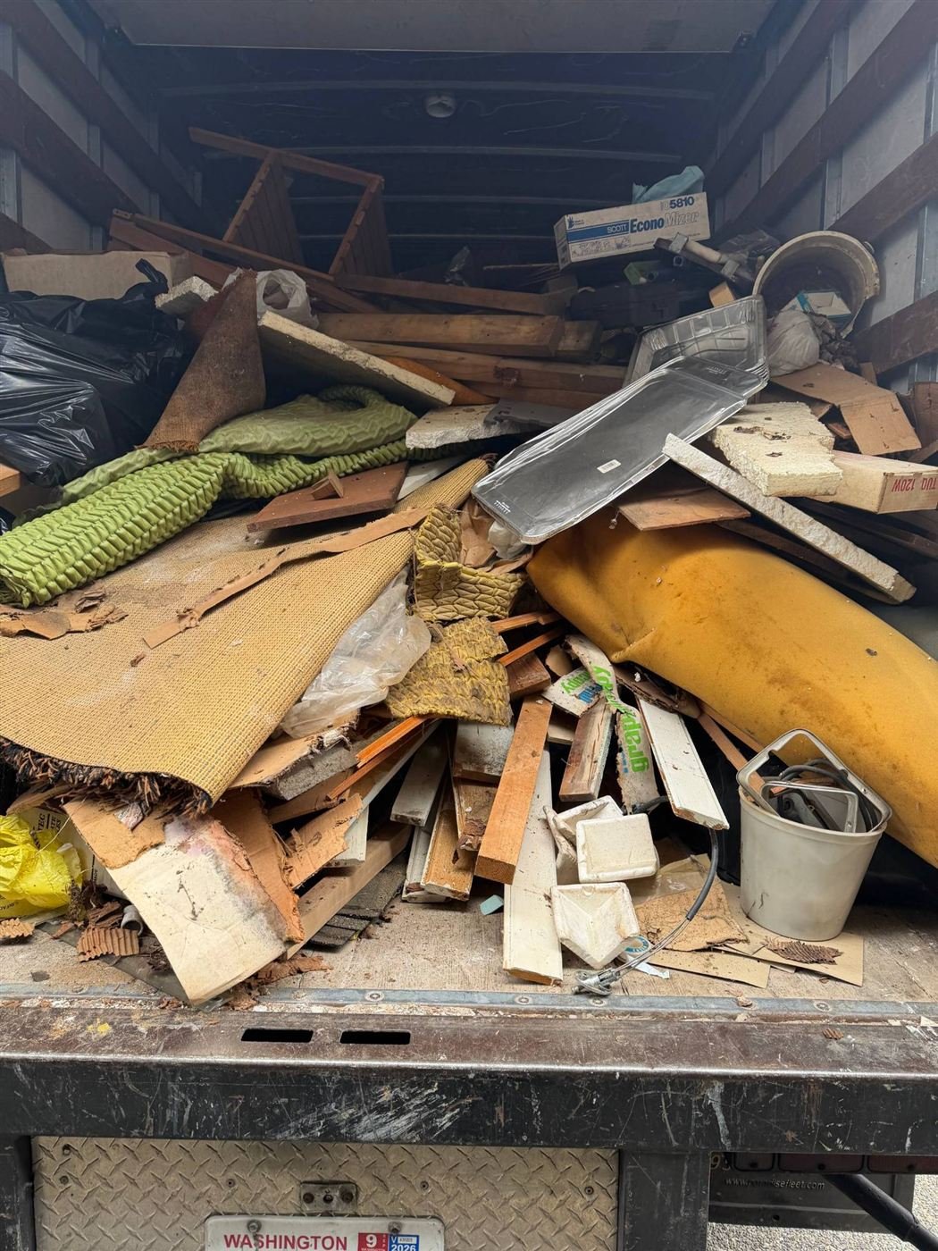 Truck loaded with junk and debris hauled in Bellevue